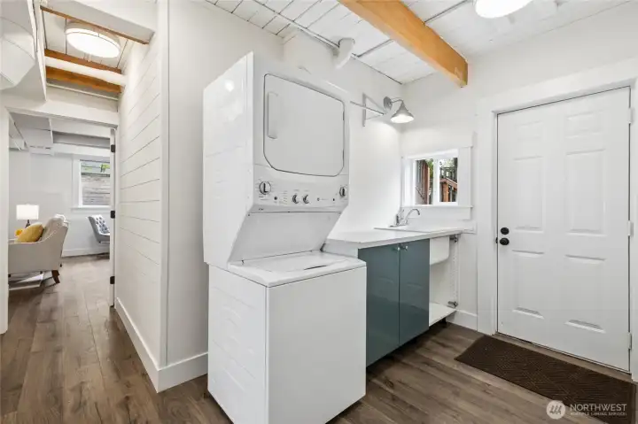Laundry area is next to the ground level back door, making it an efficient mud room.