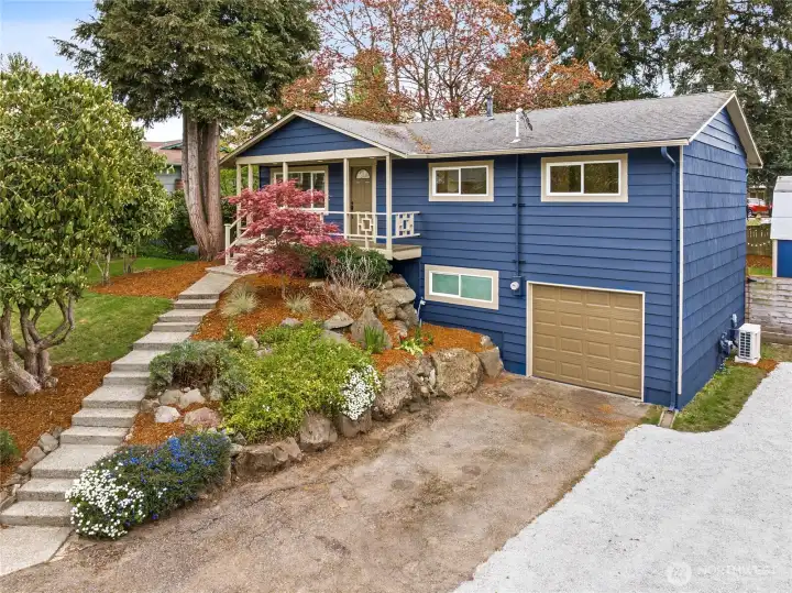 Large flat parking area to the right of the driveway could easily accommodate an RV or boat.