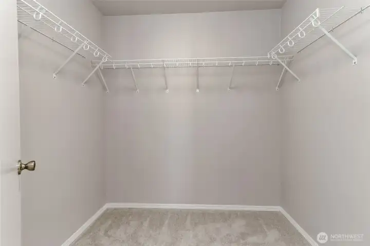 Primary bedroom walk in closet