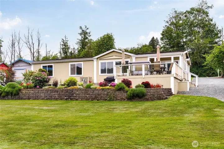 Home is so well kept! Pride of ownership! The entertaining deck has glass wind break so it doesn't interfere with the amazing views. Picture yourself with your morning tea or coffee, slowly waking up getting ready for the day! There is more storage is under the deck!