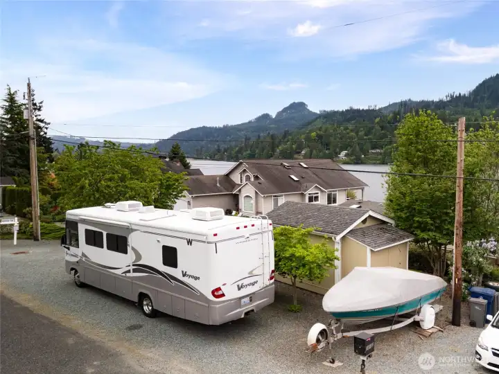 Plenty of room for our RV and Boat! Notice the kick out of the back of the Storage Cottage, it is extra room for tools!