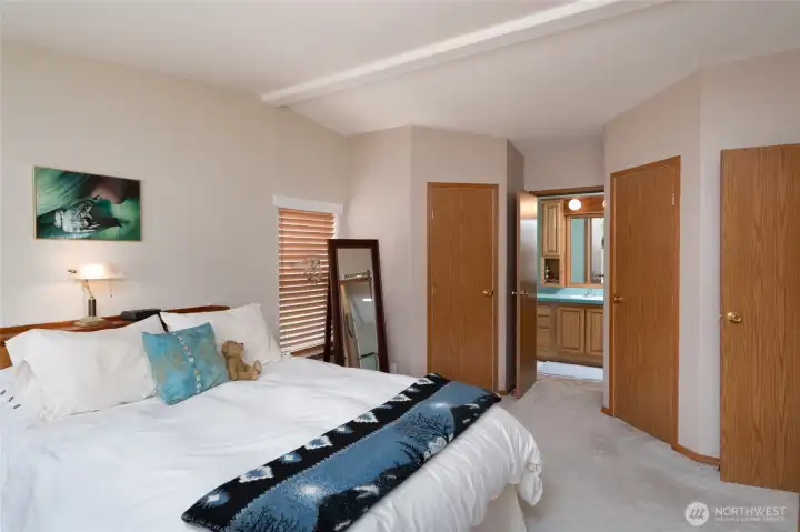 Primary suite with 2 walk in closets and private bathroom with large shower.