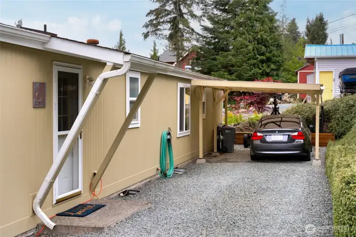 Carport and Covered Entry into the Laundry off the Kitchen.