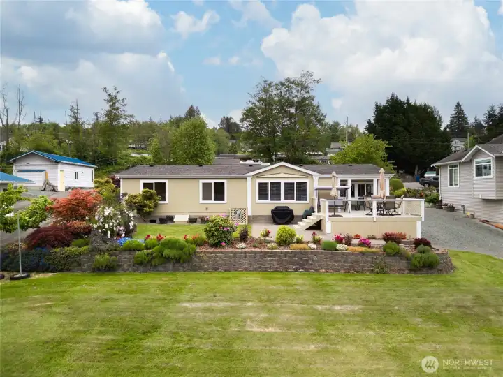 Picture yourself on that deck, cold beverage in hand relaxing and recharging after a long day! Can you smell the fresh air and the flowers? Hear the waves lapping at your dock?