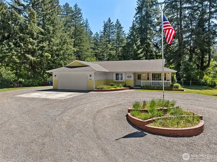Located at end of the cul-de-sac. Spacious 2-car attached garage features a 1/2 bath with utility sink for convenience.