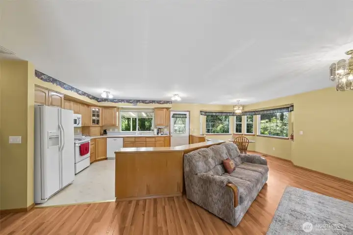 Open floorplan with great natural light & featuring gleaming, wood-laminate floors.