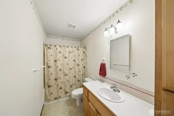 nicely designed guest-hall bath featuring a Jacuzzi tub.