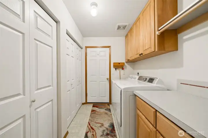 Laundry Room w/counters, cabinets, storage & a door leading to the garaage.