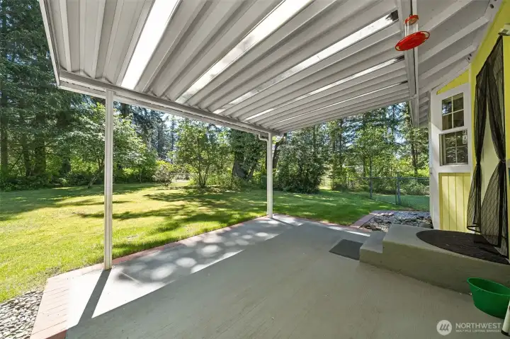 Relax or entertain on the LARGE, covered patio. Enjoy great outdoor living overlooking you 1 acre lot.