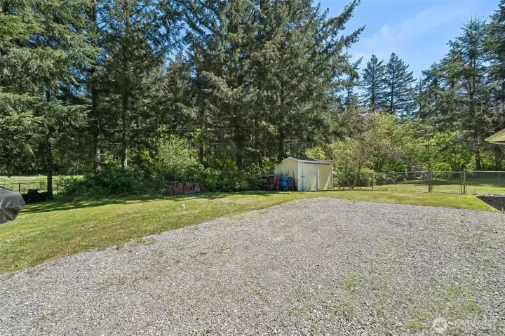 Room for RV w/all hookups. Outbuilding for additional storage.