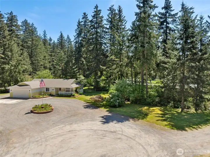 Beautifully landscaped 1 acre lot.