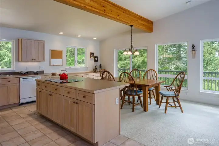 Looking from the kitchen to the dining area with the sliding door to the deck.