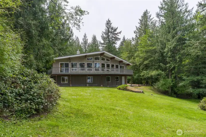 Waterfront side of the house.  Door on the bottom right goes to the garage.