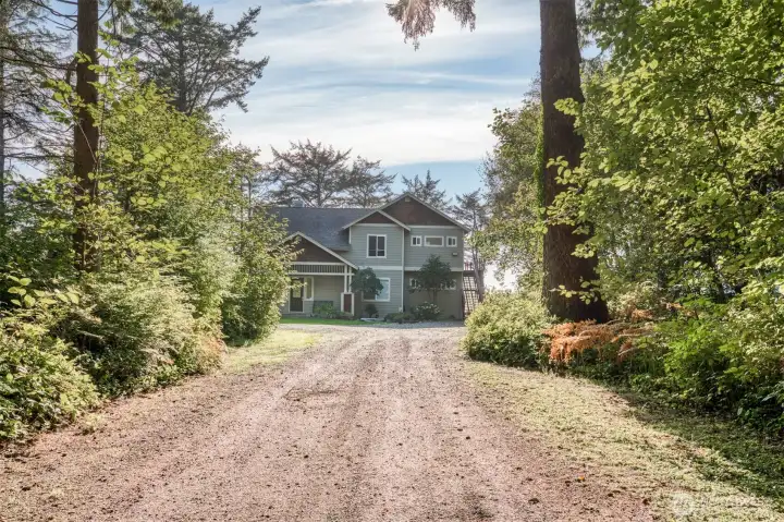 This home sits back off of State Route 109 and is 5 minutes to Seabrook and Pacific Beach. As you enter the gated property you pass through the first lot which can be developed separately or you could build another home, guest cottage or shop.  Public water and sewer is available.