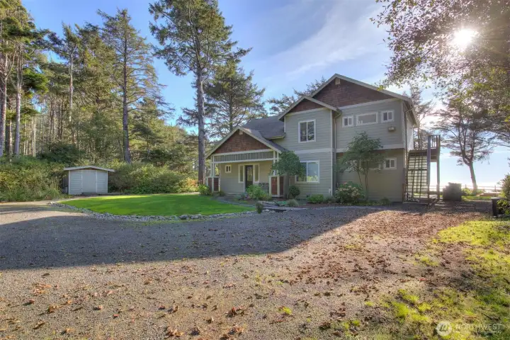 The front yard offers plenty of guest parking and room to play.