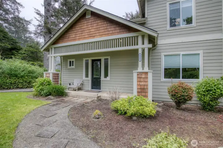 Enter into the large entry off the covered front porch.