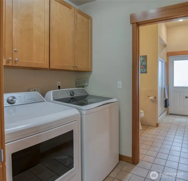 The main floor laundry with 3/4 bath and direct back yard access.