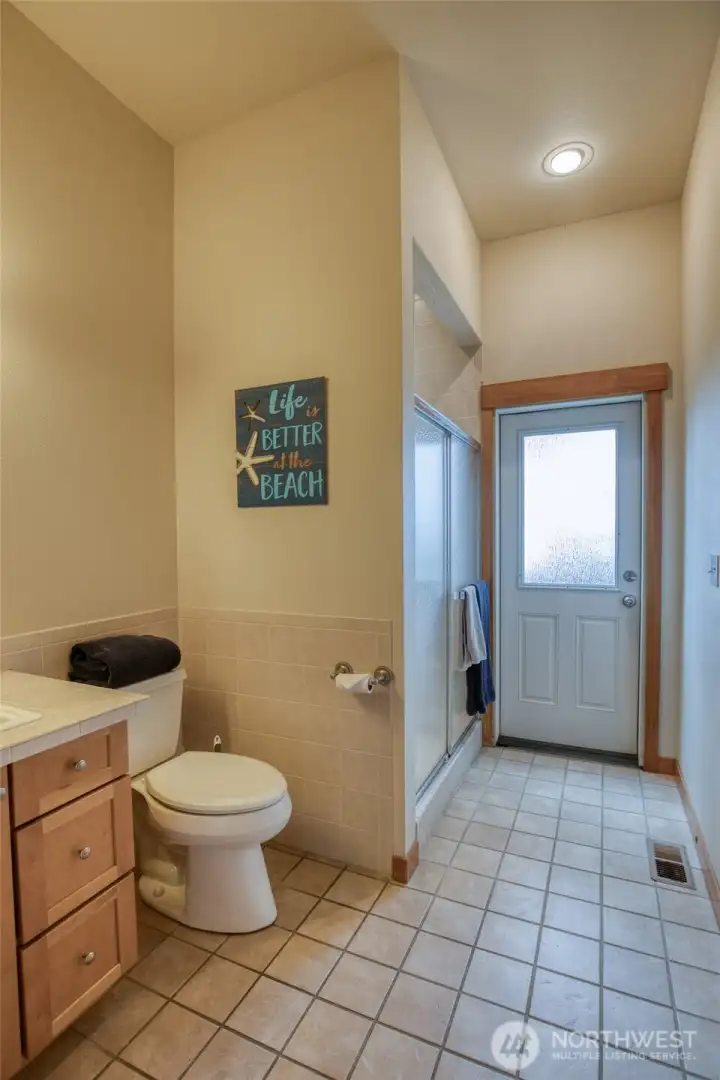 The 3/4 main floor shared bath with exterior access.
