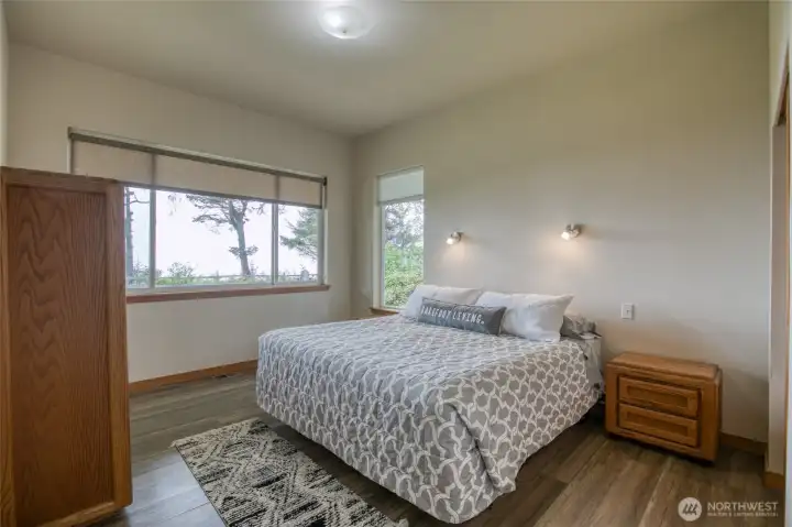 The main floor primary bedroom offers spectacular ocean front views.