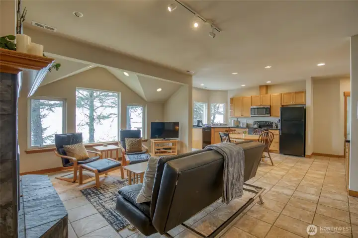 The upstairs living space is full of light and open the dining and 2nd kitchen space.