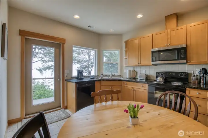 Off the kitchen (and on the oceanside) is a beautiful....