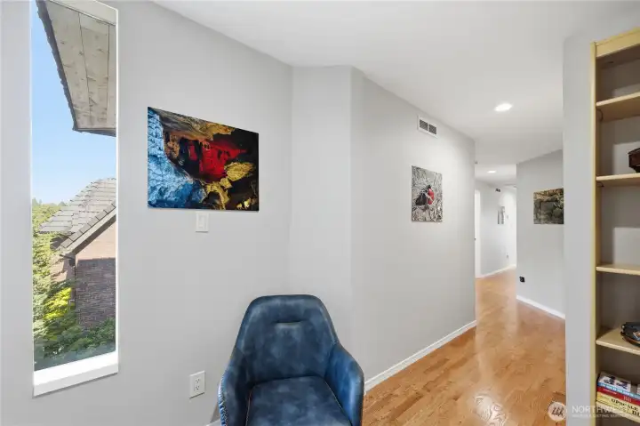 Upon entering, you will be greeted by the charm of hardwood floors, modern lighting, and a contemporary feel.  Bedrooms are on the left, and the living room is at the end of the hallway.