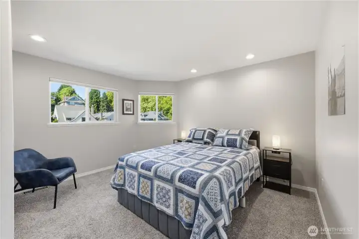 Primary bedroom with an abundance of natural light.