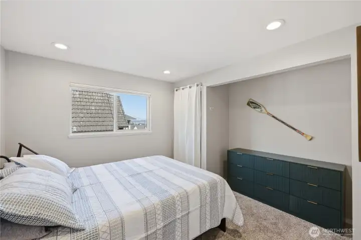 The second bedroom with more storage, new carpets and new lighting.