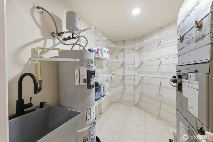 Spacious utility room with more storage space.