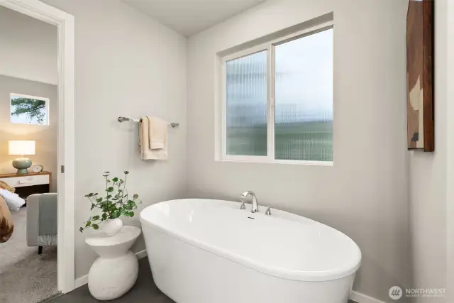 Soaking Tub next to shower in Primary Bath