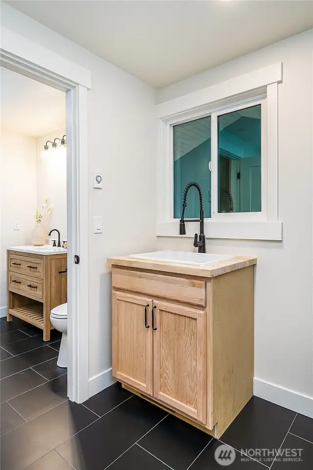 A practical utility room sink adds functionality, ideal for laundry, cleaning, and any household chores