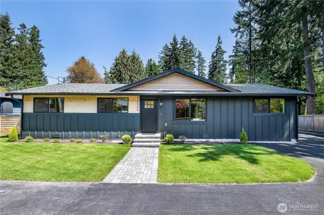 The newly laid sod and charming brick walkway lead you to the front door, enhancing the home's curb appeal and providing a welcoming entrance.