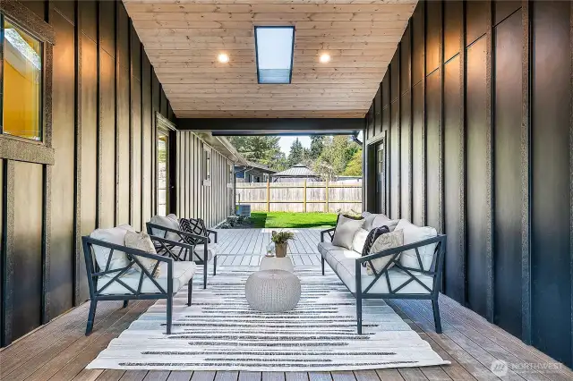 Welcome to your own slice of paradise, featuring a charming breezeway that connects the kitchen to a spacious bonus room