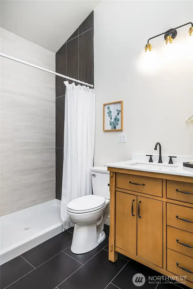 Enjoy a tastefully designed bathroom adjoining the spacious bonus room—perfect for guests or extended stays