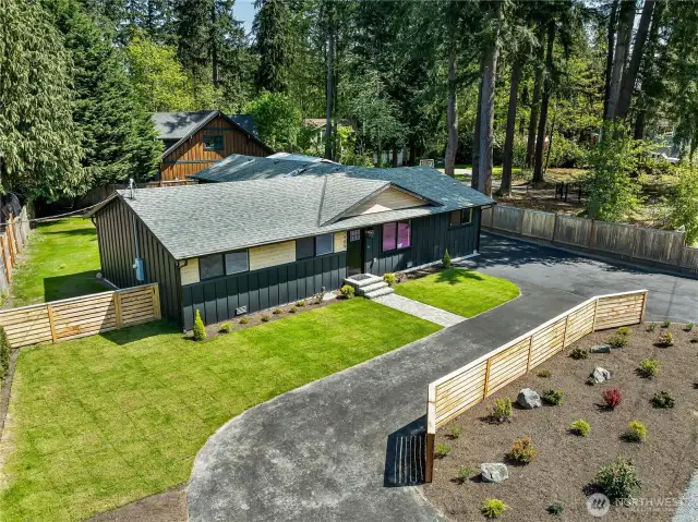 A beautifully designed semi-circle driveway offers smooth access and convenience, making arrival and departure a breeze