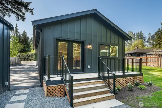 French doors lead from the bonus space to a peaceful, private deck—your own outdoor retreat