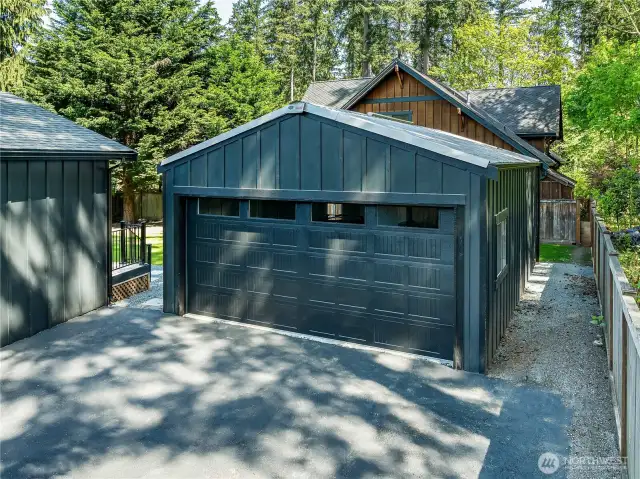 Spacious detached garage offers ample room for parking, storage, or a workshop