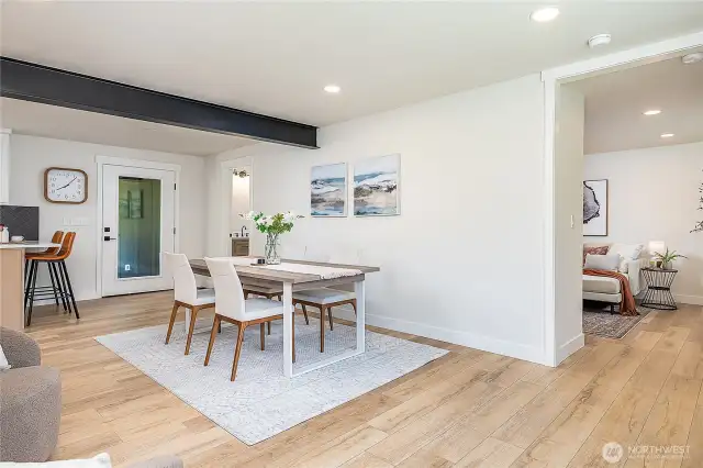 The dining room and family room offer a perfect balance of form and function, providing ample space for entertaining and family activities