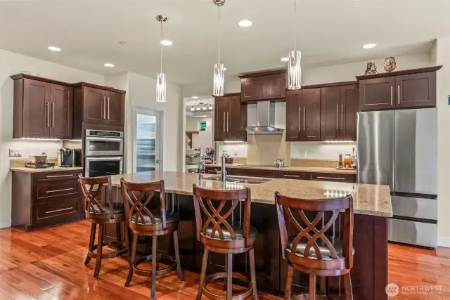 Stunning kitchen with so much storage and a great walk in pantry viewed from the great room