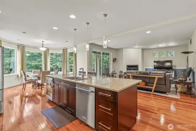 Kitchen Island with Quartz countertops and additional storage, soft close cupboards and drawers, over looking great room