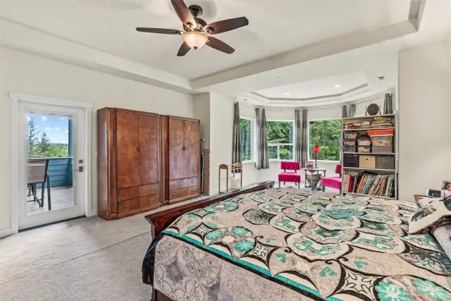 Primary bedroom (upstairs) with deck to enjoy the view and serenity this home has to offer