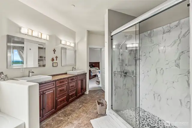 Primary ensuite bathroom with stunning tiled shower and extra-large soaking tub