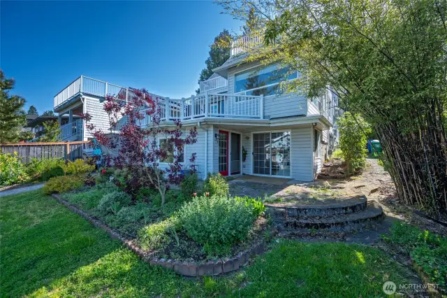 View of the back of the house, gardens and entry to downstairs backyard unit
