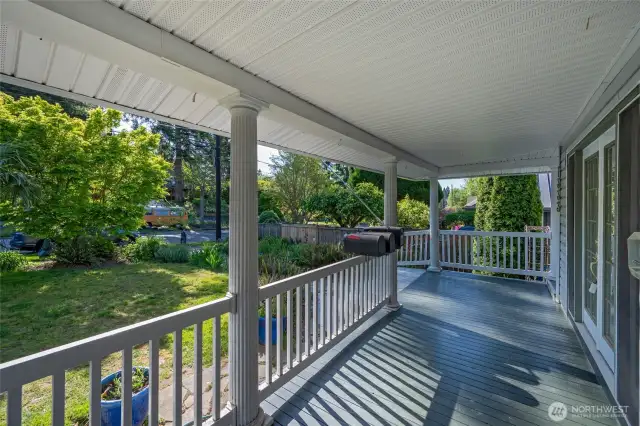 7333 39th Ave SW gracious wraparound front porch with glider swing