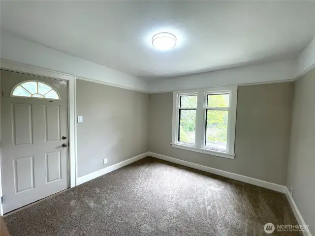 Here is the primary bedroom, showing the two windows and the exit doorway for convenience to the back yard.