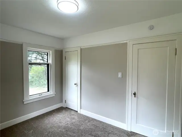 Bedroom number three, with the entry door on the right and the cedar lined closet on the left.