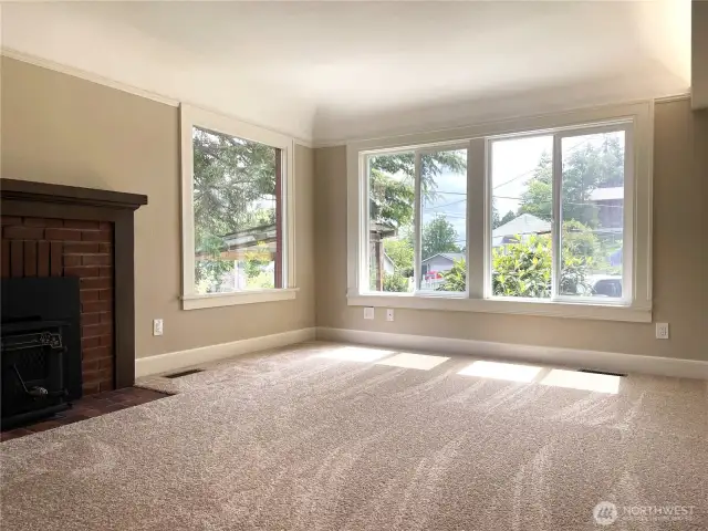 The living room has brand new carpeting and has been freshly painted. The house sits on the top of a hill and the view is quite expansive and includes Mt. Rainier and the Cascade Range!
