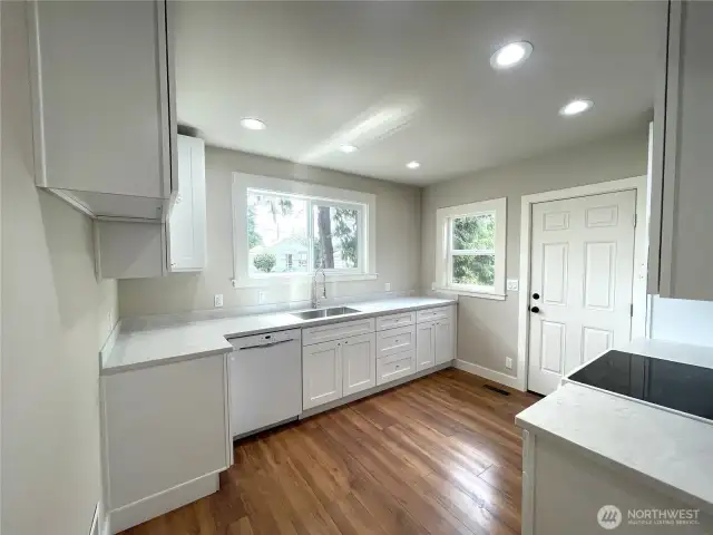 All new kitchen. Be the first to use this brand new kitchen. The Corian countertops are beautiful. The drawers and cabinets are soft close and all appliances match and stay.