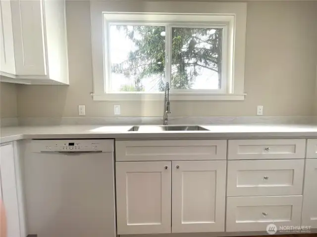 The view is lovely from the kitchen as you will see. Clean those dishes good with a Bosch brand dishwasher!