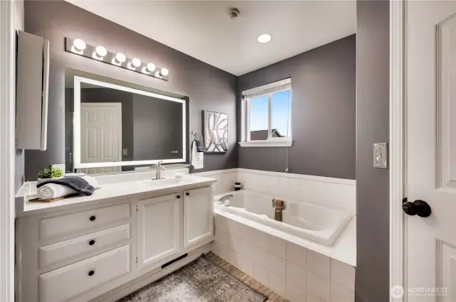 Primary bath, separate shower and high-tech mirror